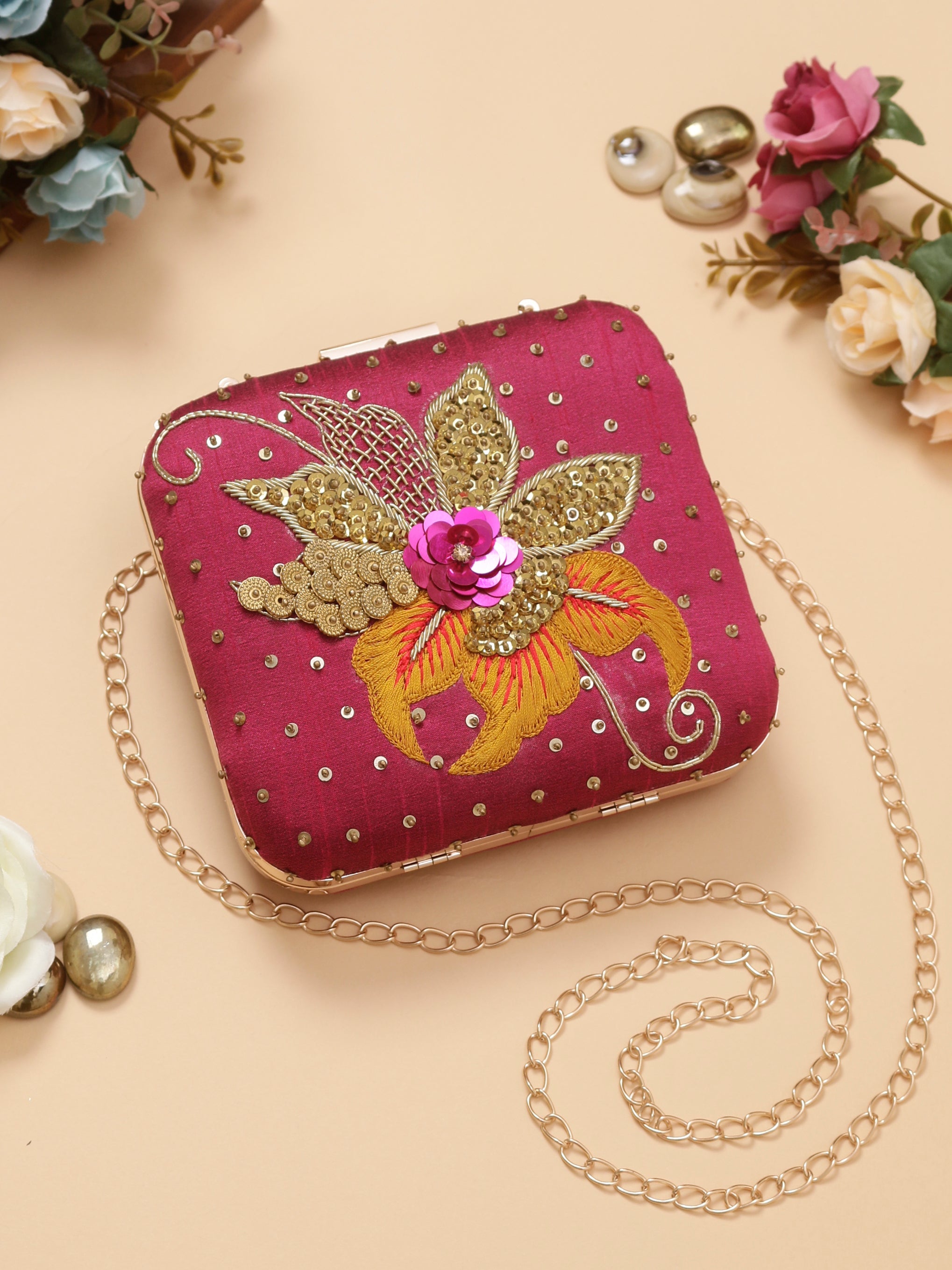 Swisni pink embroidered clutch bag