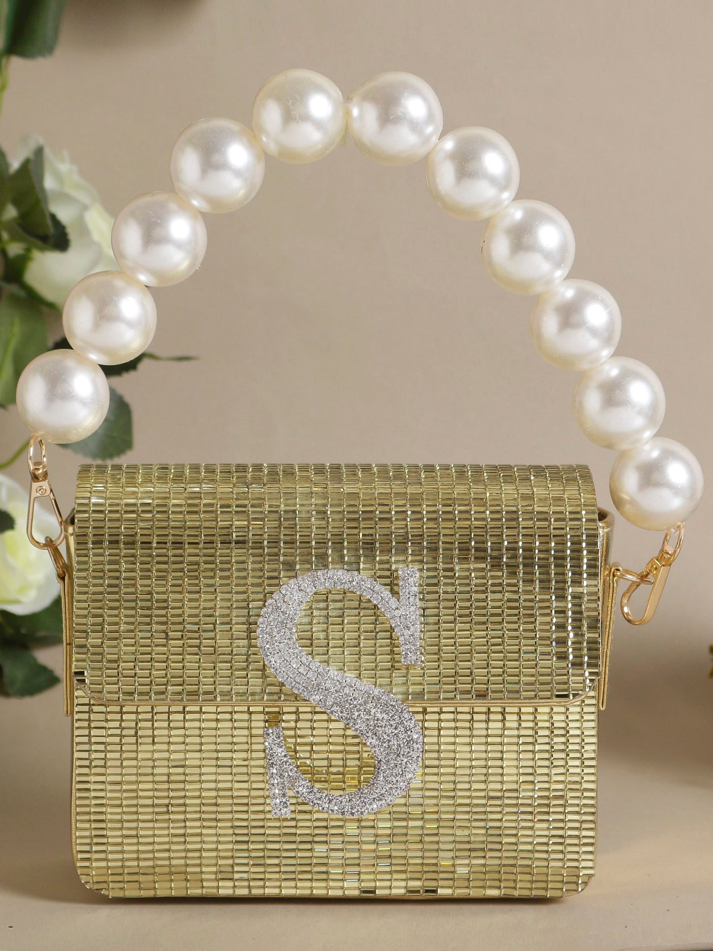 Swisni golden monogram clutch bags