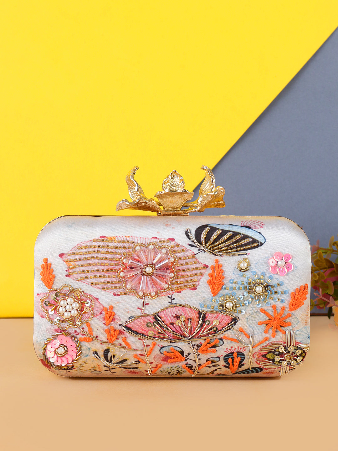 Eye catchy embellishment designer clutch