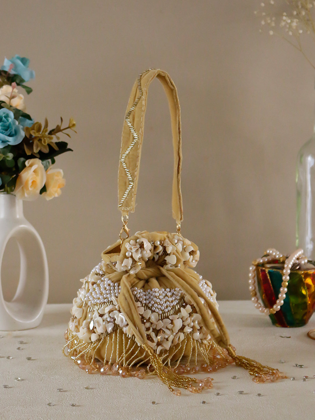 Swisni noorah velvet potli bag