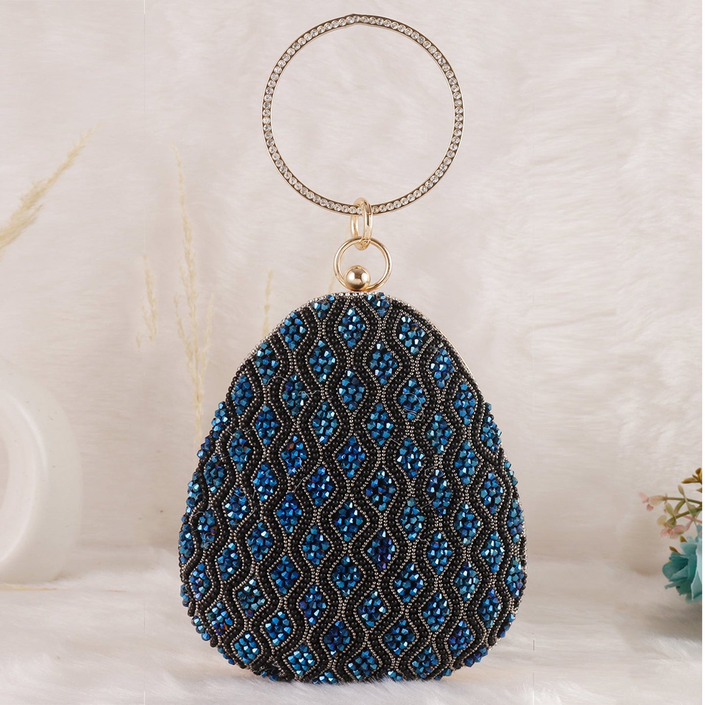 Elegant almond shape blue embelishmet clutch