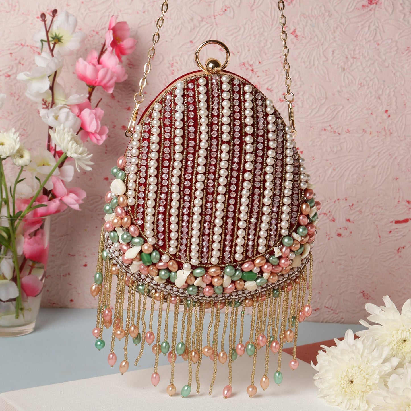 Swisni almond shape tassel embroidery clutch