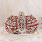 Softy embroidered silk maroon oval clutch