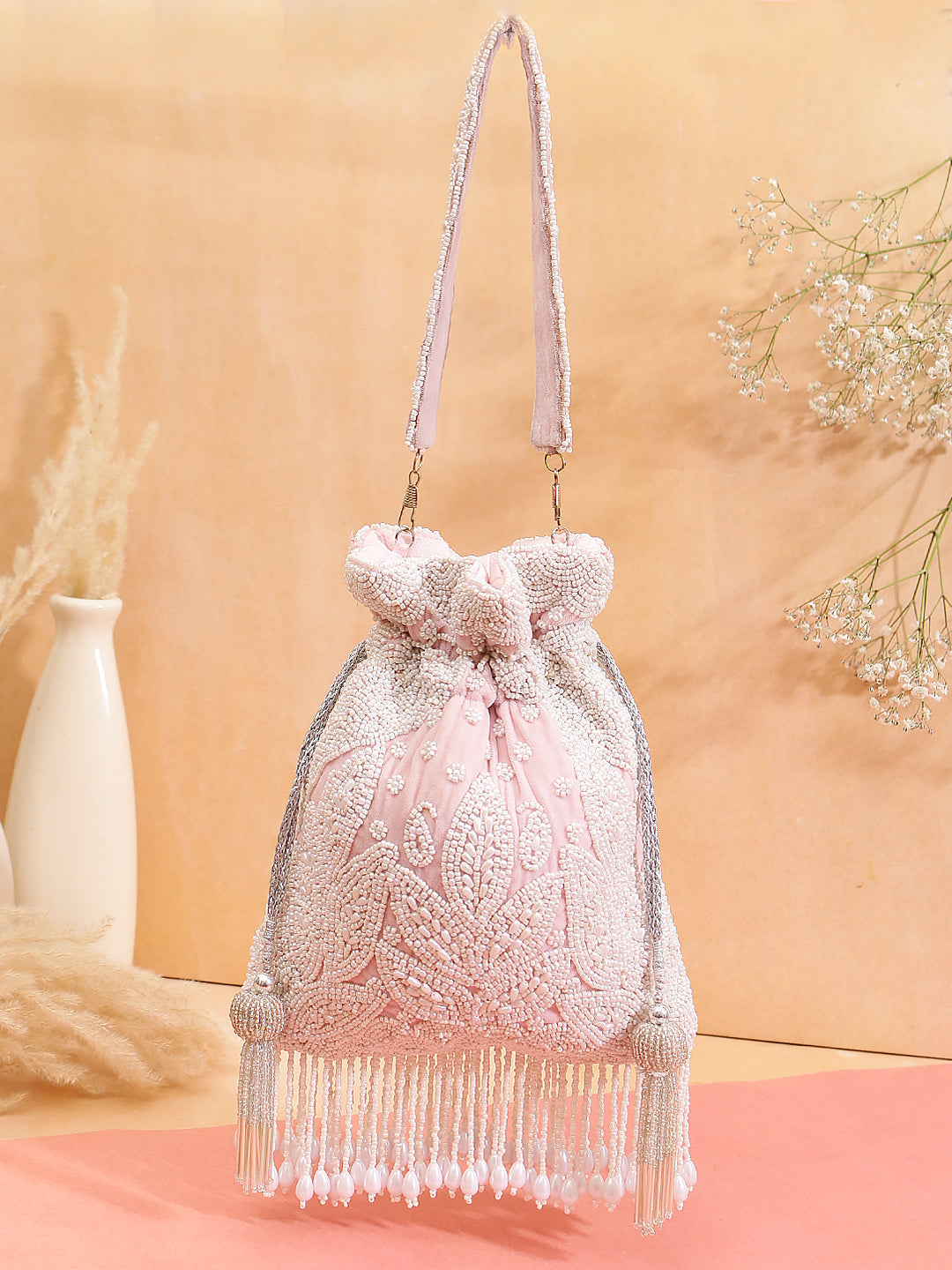 swisni pearl tassel baby pink potli