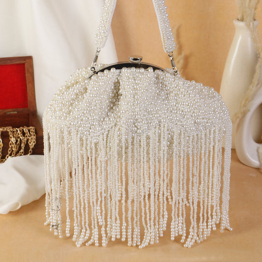 Swisni enhancing pearl tassel batua clutch