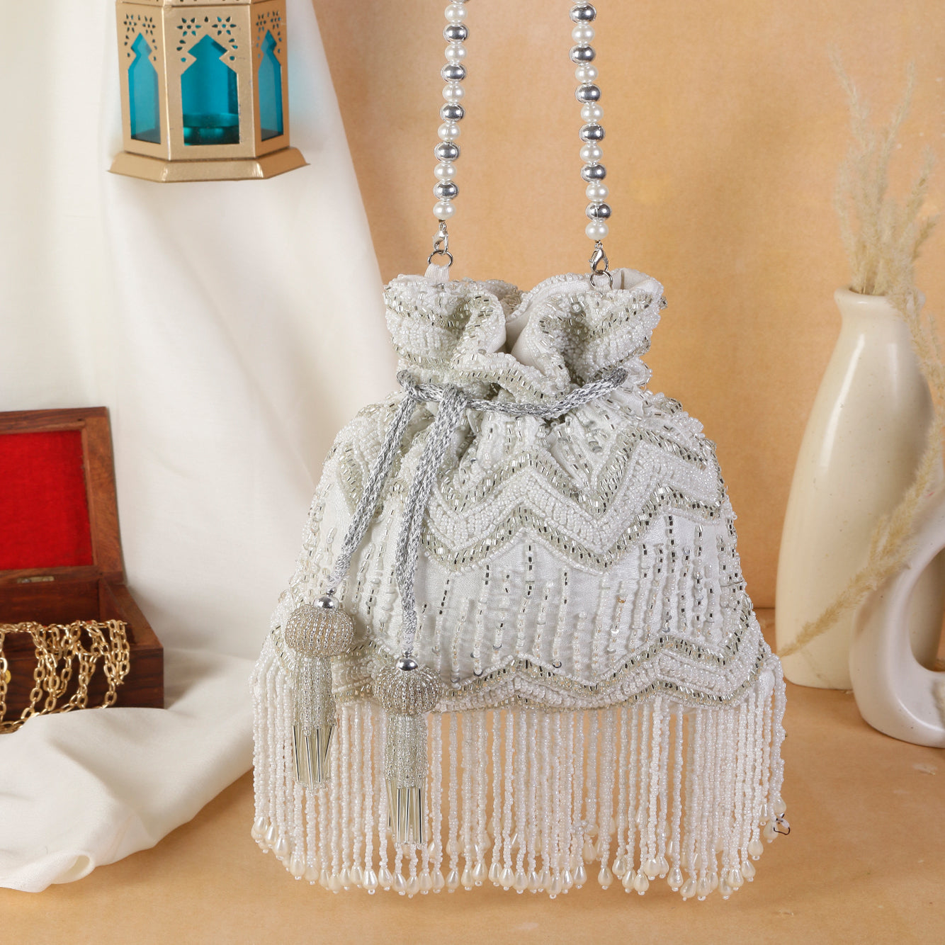 Swisni white tassel potli