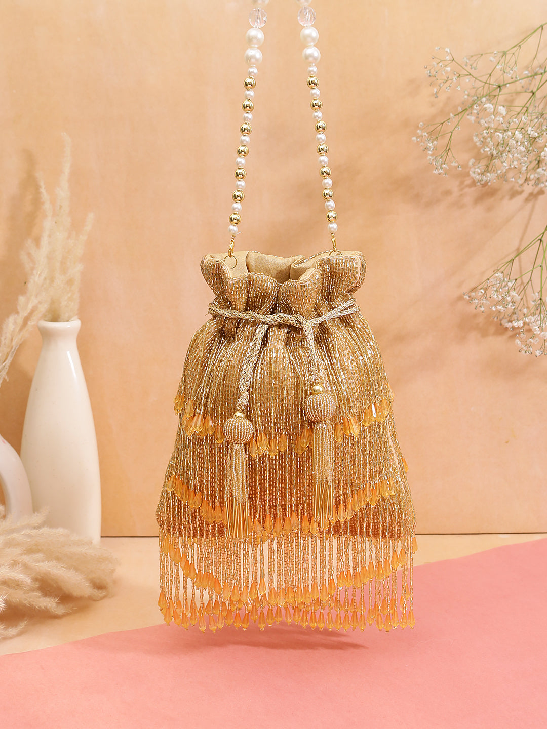 Swisni  tassel gold potli