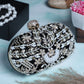 Handmade-embellishment black oval clutch