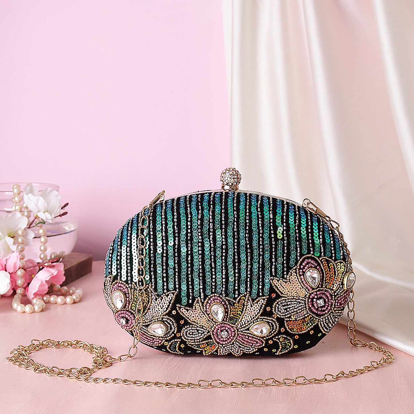 Reflected sequins oval embroidery clutch