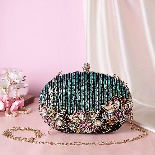 Reflected sequins oval embroidery clutch